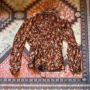 Sheer long sleeve top with a tassel waist tie